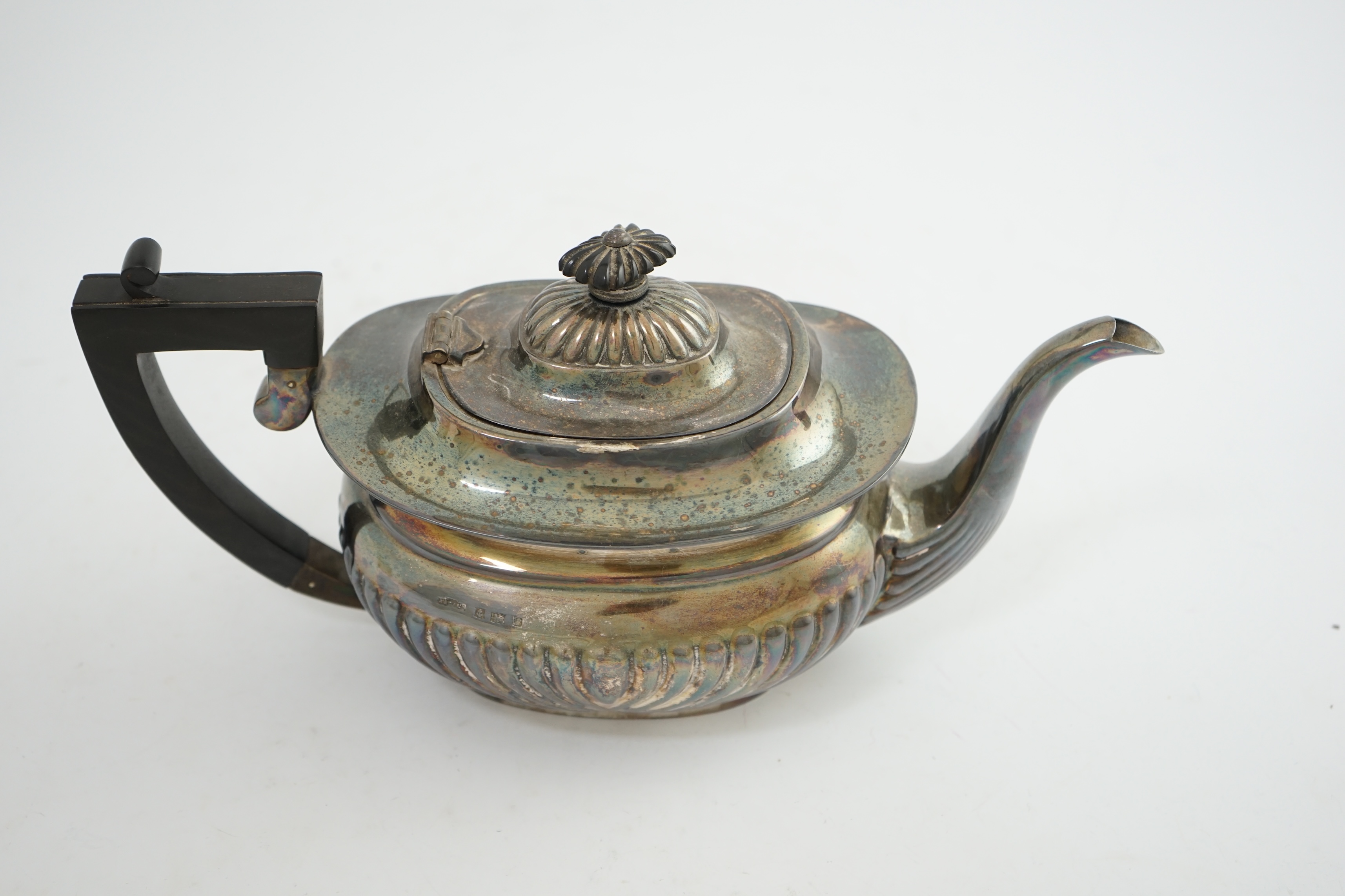 An Elizabeth II demi-fluted silver teapot, by Asprey & Co Ltd